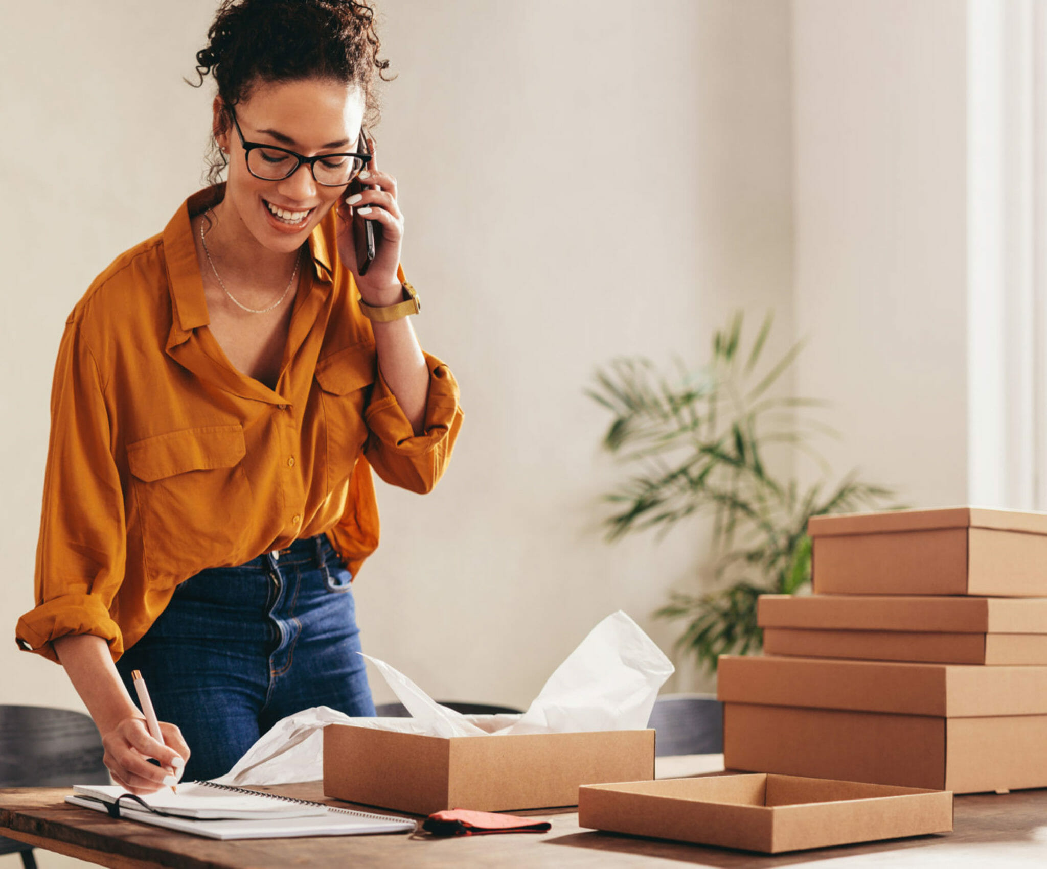 Small business person filling website orders.